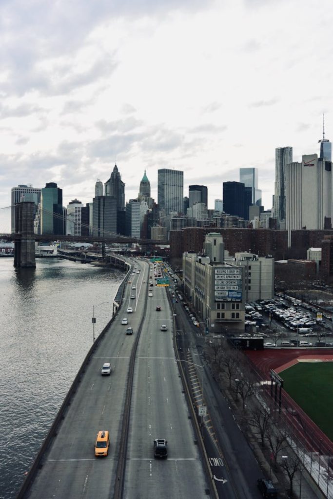 A captivating aerial view of Manhattans skyline with a bridge and busy roads, New York City.