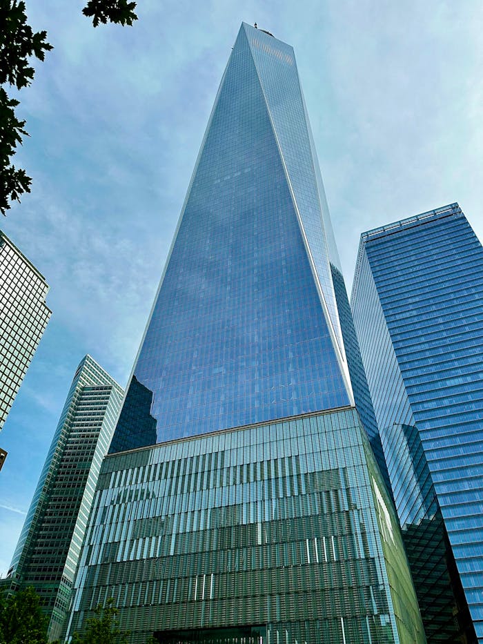 Stunning view of the One World Trade Center against a clear sky in New York City.